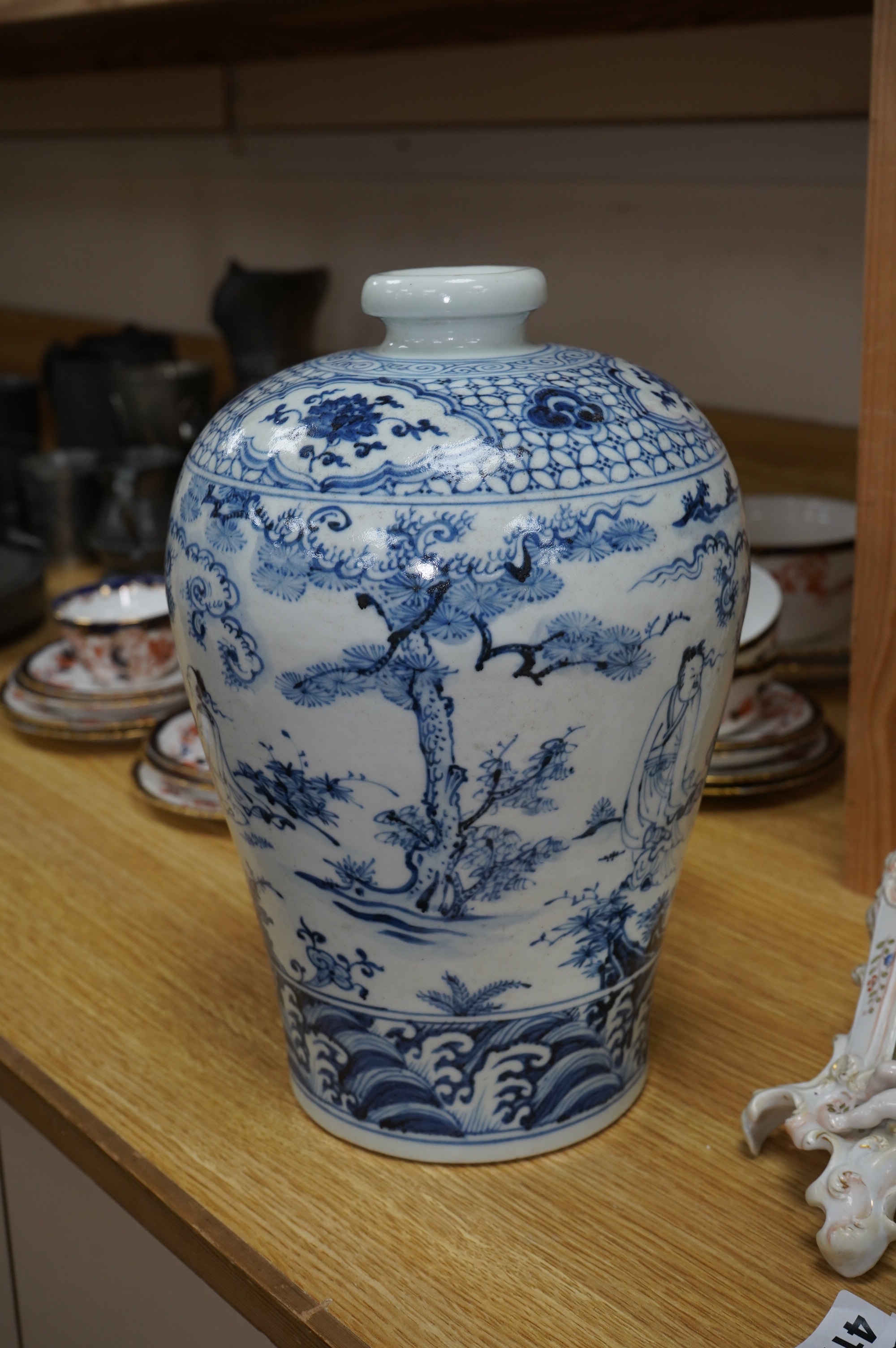 A Chinese blue and white vase, decorated with figures before a landscape, 31cm high. Condition - good